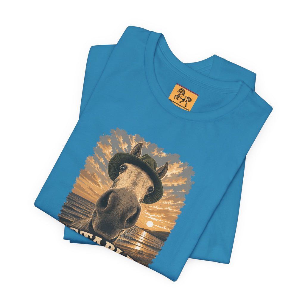 Stable Selfie Club unisex t-shirt blue, featuring original equestrian artwork of a horse wearing a hat taking a selfie at sunset on a beach, printed on Bella & Canvas 3001 tee by Hay there Horse Art.
