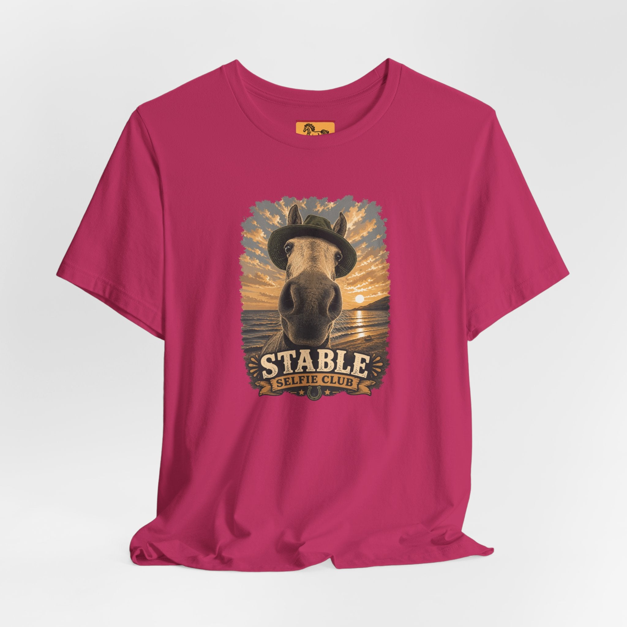 Stable Selfie Club unisex t-shirt  featuring original equestrian artwork of a horse wearing a hat taking a selfie at sunset on a beach, printed on Bella & Canvas 3001 tee by Hay there Horse Art.
