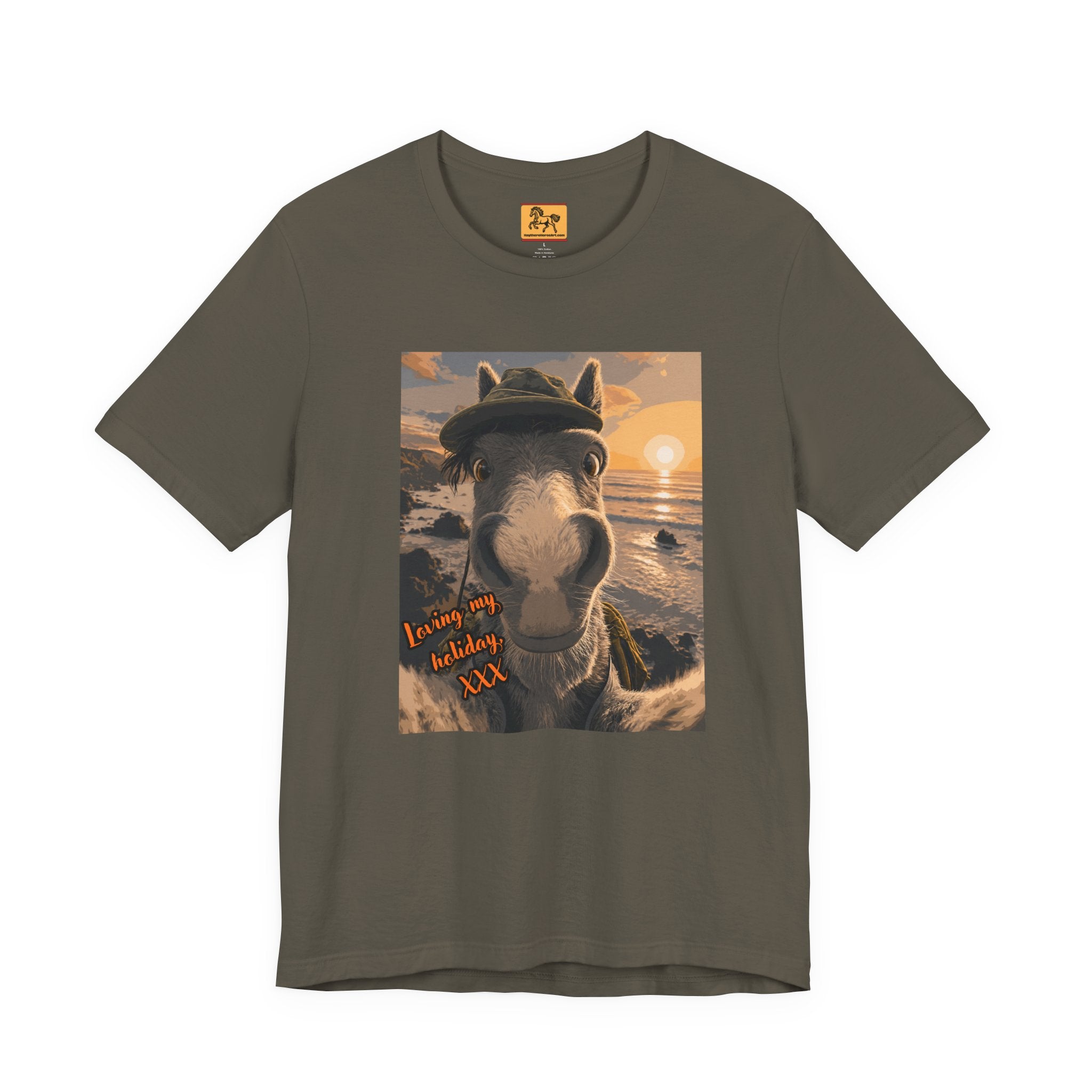 An army green Bella + Canvas 3001 unisex t-shirt featuring an illustrated horse taking a beach selfie at sunset, wearing a hat, with the words 'Loving my holiday XXX' in orange script. 