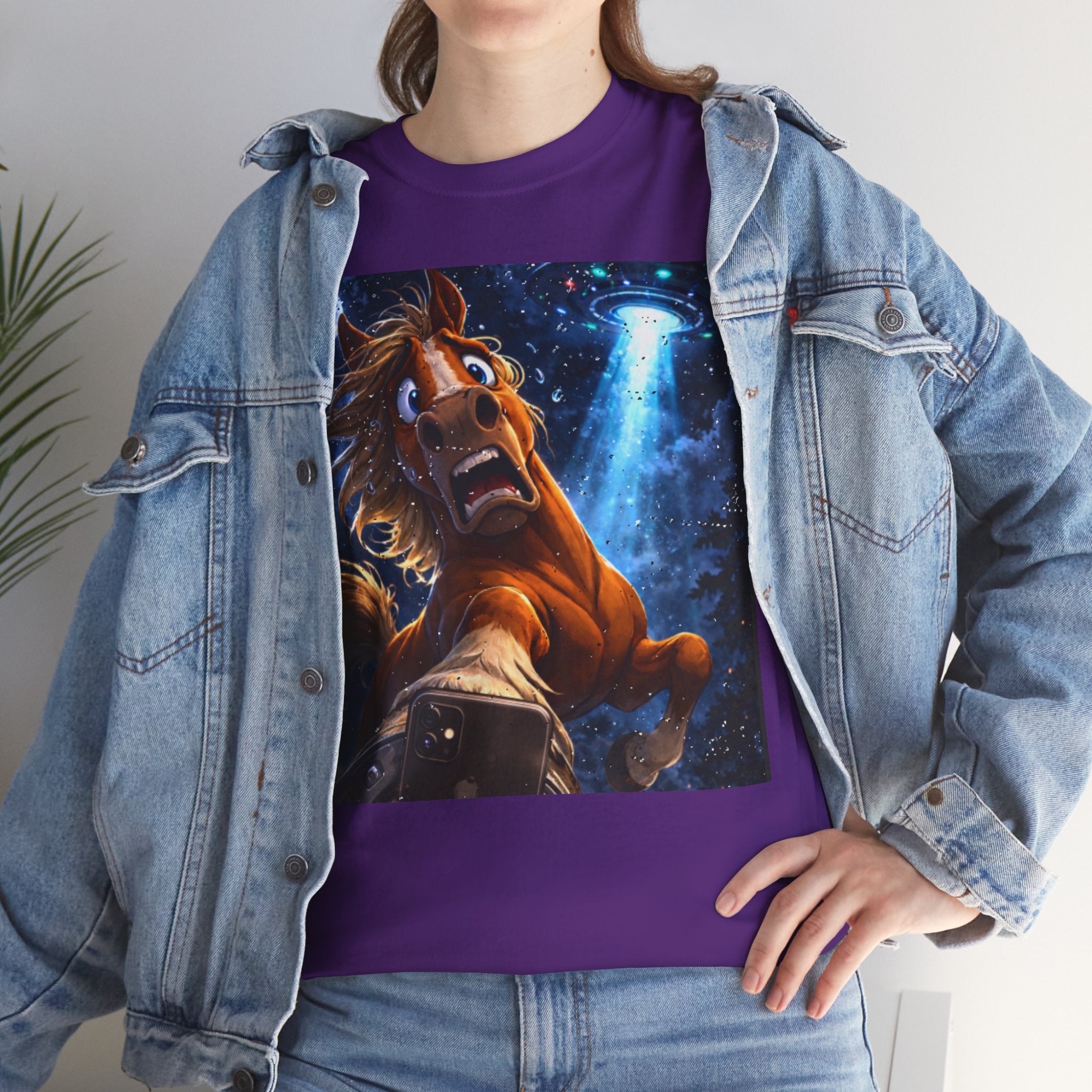Person wearing a purple t-shirt with a horse UFO selfie graphic and denim jacket.  Funny Tee.