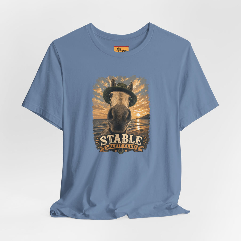 Stable Selfie Club unisex t-shirt  featuring original equestrian artwork of a horse wearing a hat taking a selfie at sunset on a beach, printed on Bella & Canvas 3001 tee by Hay there Horse Art.