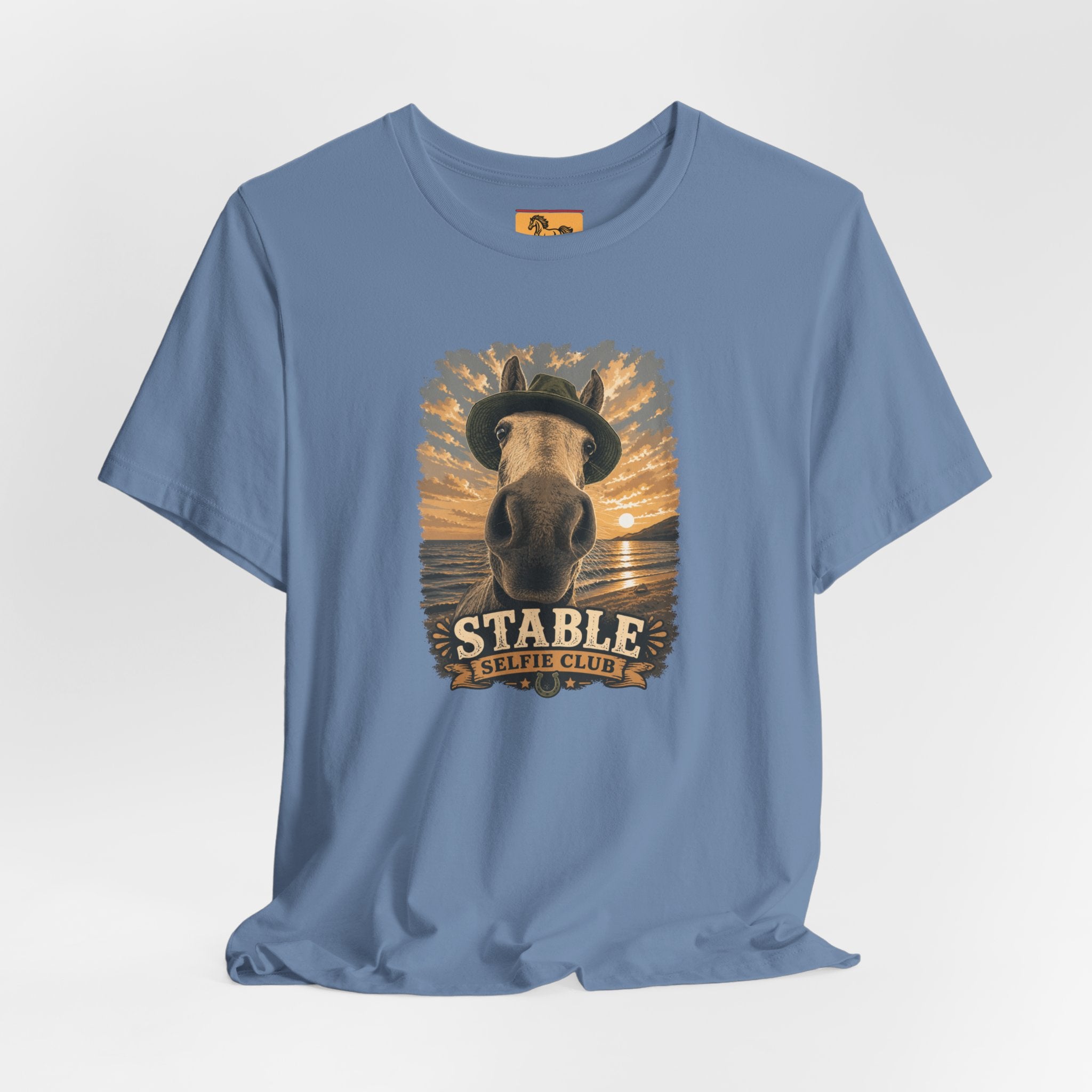 Stable Selfie Club unisex t-shirt  featuring original equestrian artwork of a horse wearing a hat taking a selfie at sunset on a beach, printed on Bella & Canvas 3001 tee by Hay there Horse Art.