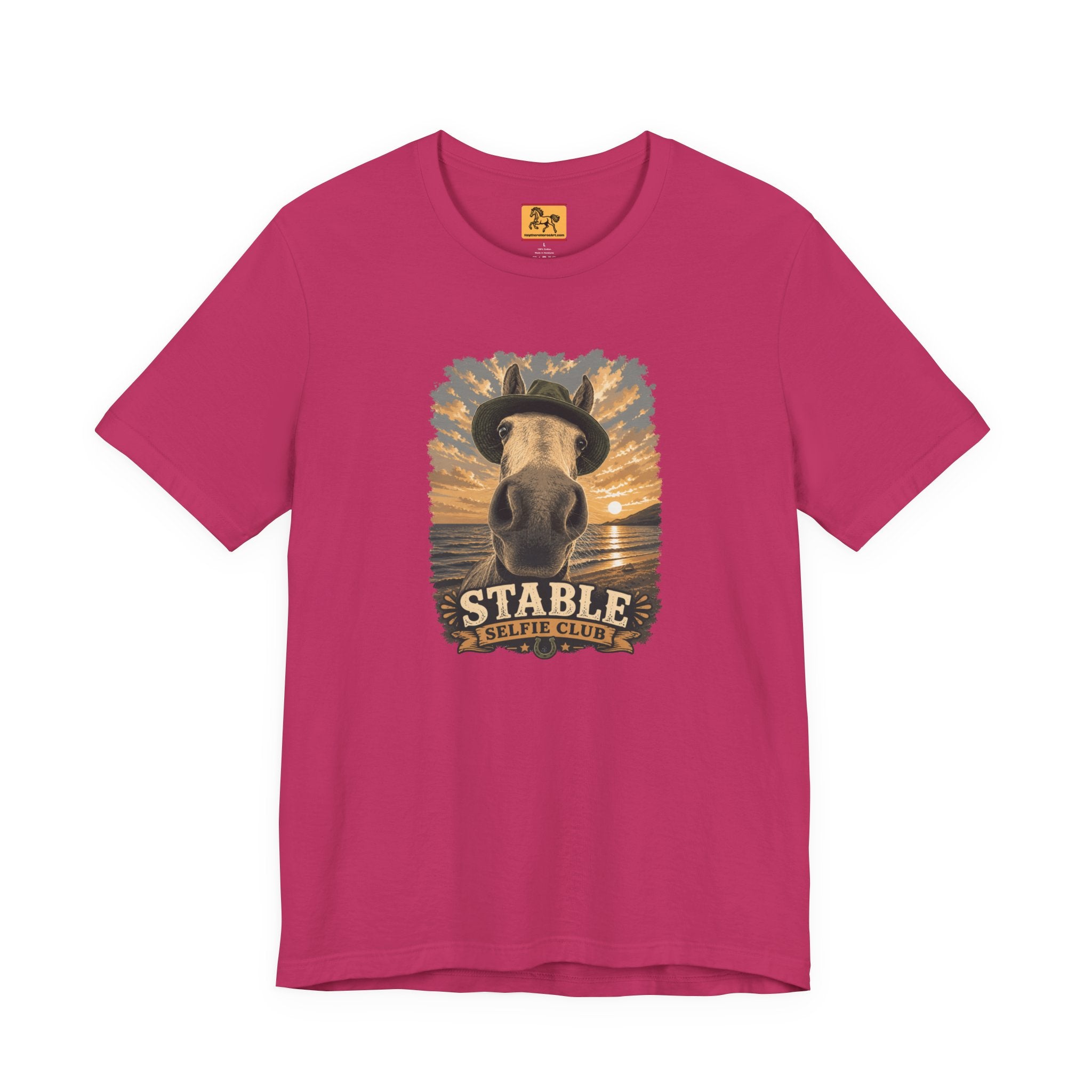 Stable Selfie Club unisex t-shirt in berry, featuring original equestrian artwork of a horse wearing a hat taking a selfie at sunset on a beach, printed on Bella & Canvas 3001 tee by Hay there Horse Art.