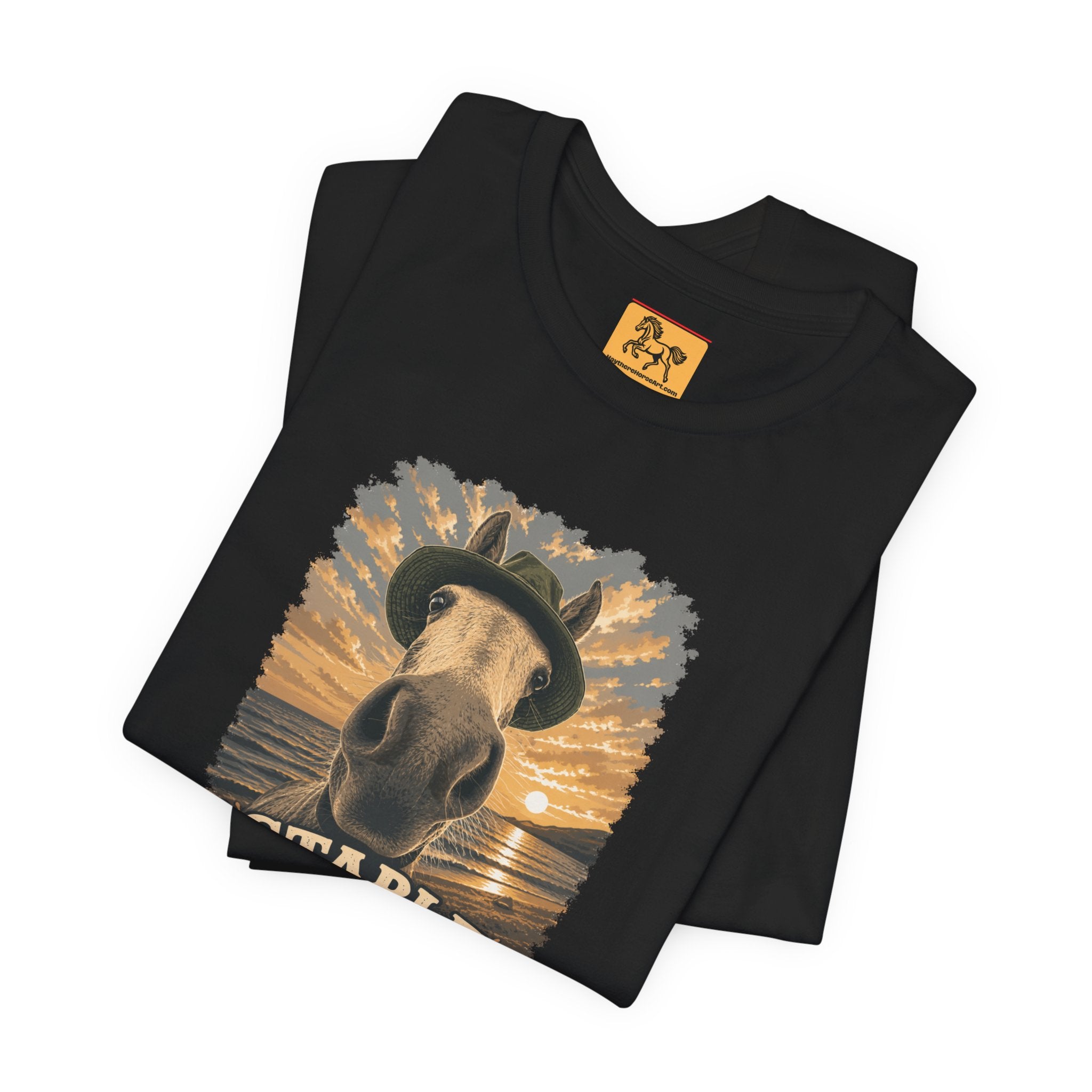 Stable Selfie Club unisex t-shirt in black, featuring original equestrian artwork of a horse wearing a hat taking a selfie at sunset on a beach, printed on Bella & Canvas 3001 tee by Hay there Horse Art.