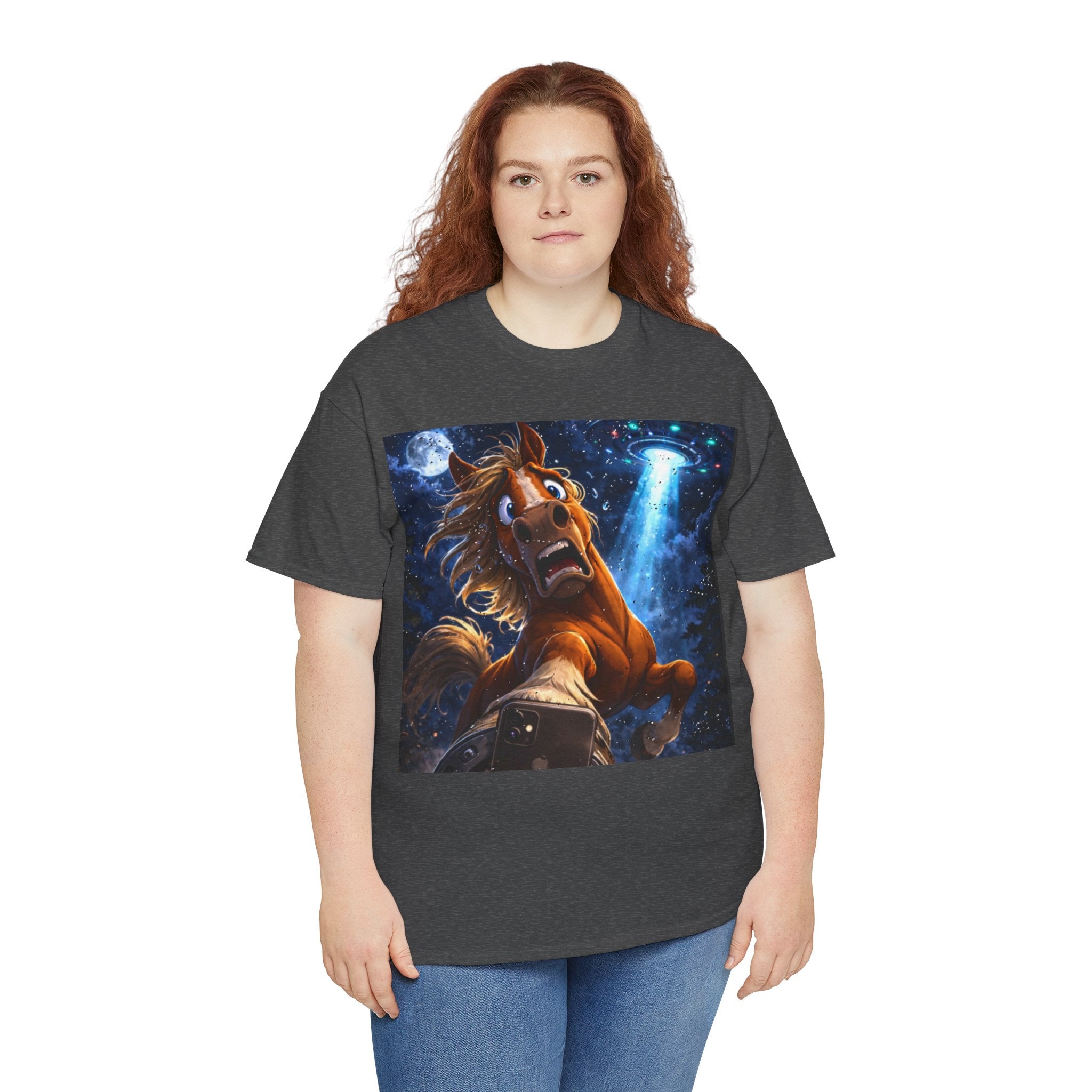 Person wearing a dark gray t-shirt with a graphic of a horse taking a selfy with a UFO and a starry sky design.  Funny Tee