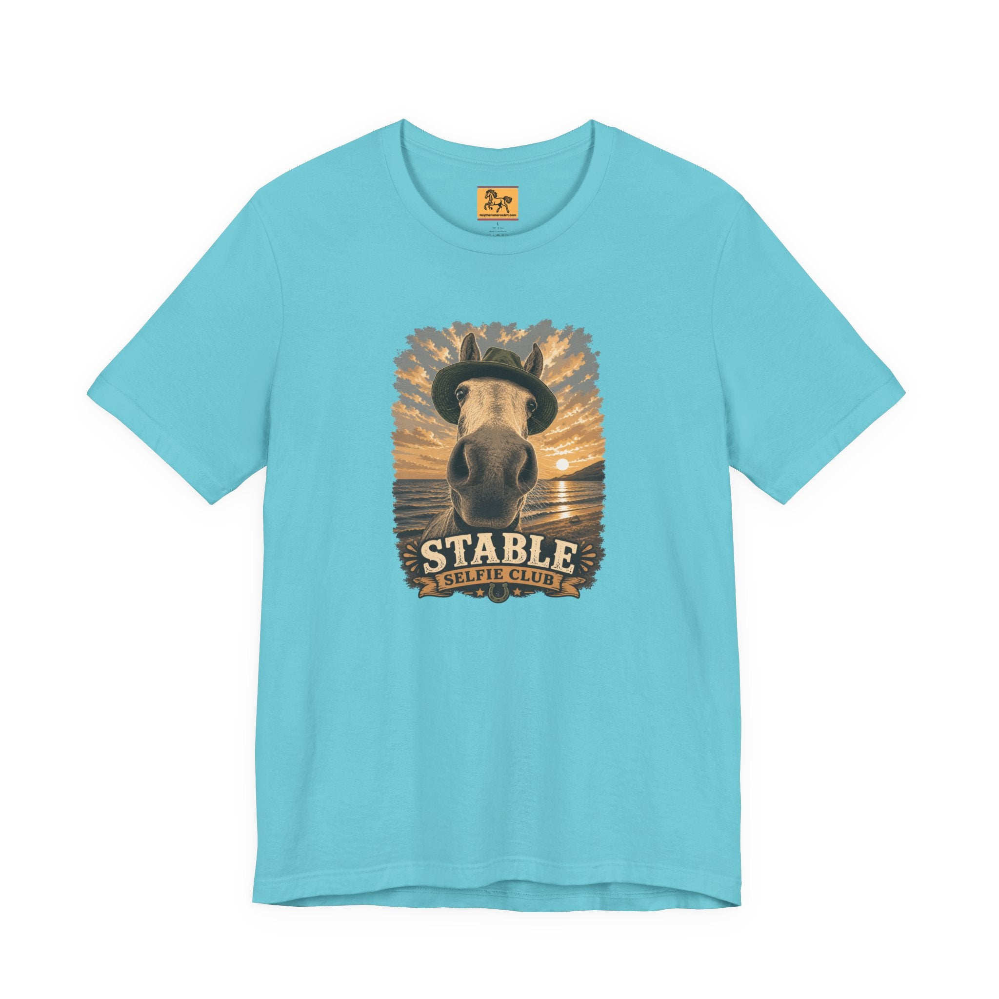 Stable Selfie Club unisex t-shirt in turquoise, featuring original equestrian artwork of a horse wearing a hat taking a selfie at sunset on a beach, printed on Bella & Canvas 3001 tee by Hay there Horse Art.