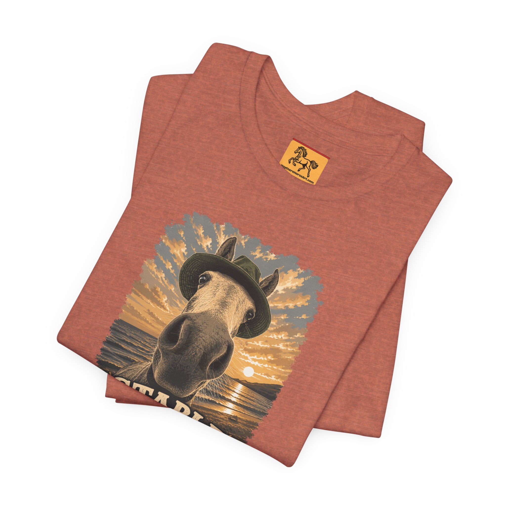 Stable Selfie Club unisex t-shirt in heather clay, featuring original equestrian artwork of a horse wearing a hat taking a selfie at sunset on a beach, printed on Bella & Canvas 3001 tee by Hay there Horse Art.
