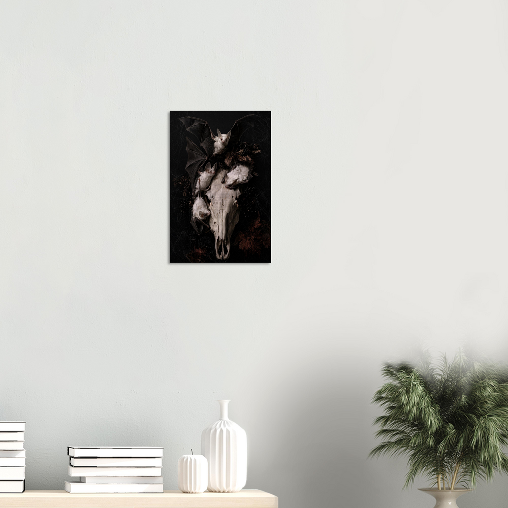 Gothic vanitas metal wall art print of three albino bats and a weathered horse skull with glowing eye sockets, surrounded by dried botanicals and cobwebs on a black background, Dutch Golden Age still life style, brushed aluminum print