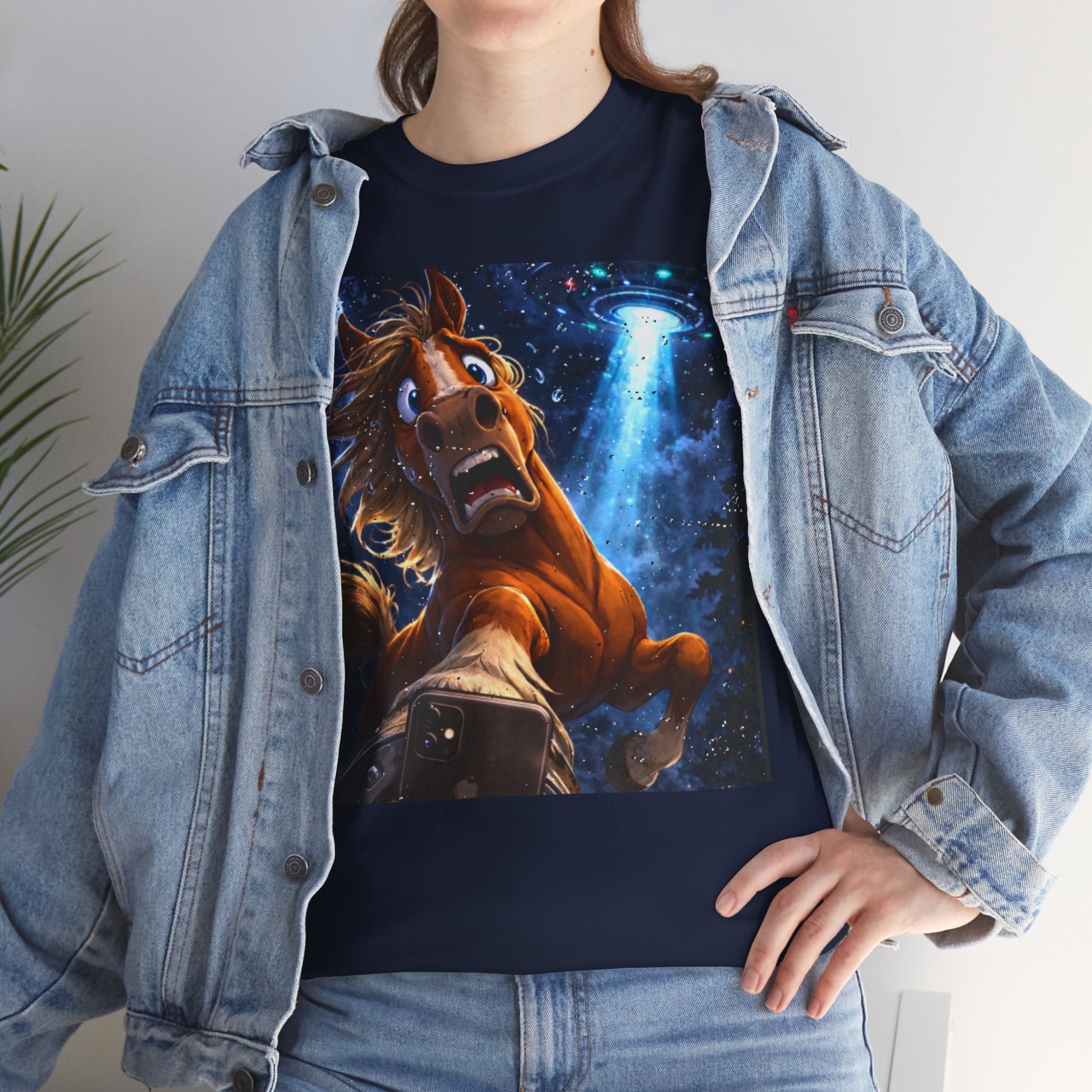 Person wearing a navy t-shirt with a horse taking a selfy with a UFO graphic. Wearing a denim jacket.  Funny Tee.