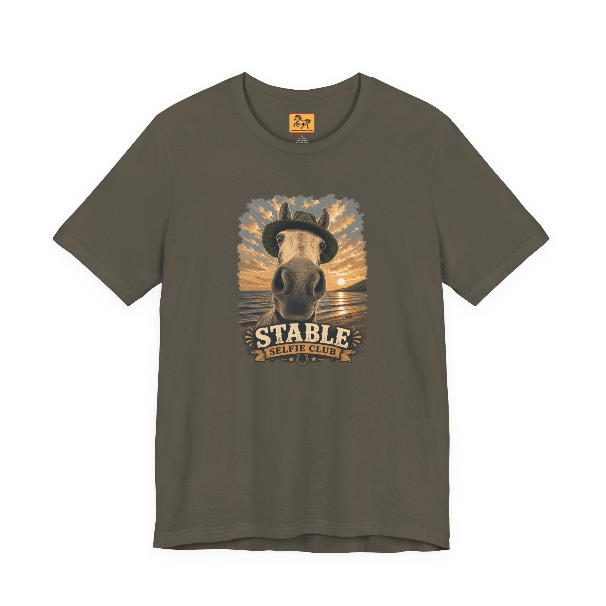 Stable Selfie Club unisex t-shirt in army, featuring original equestrian artwork of a horse wearing a hat taking a selfie at sunset on a beach, printed on Bella & Canvas 3001 tee by Hay there Horse Art.