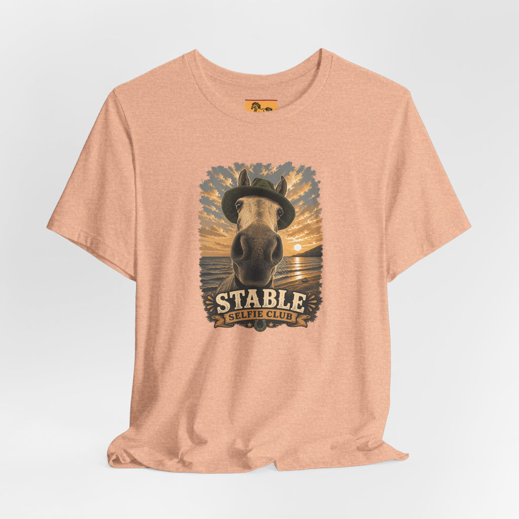 Stable Selfie Club unisex t-shirt  featuring original equestrian artwork of a horse wearing a hat taking a selfie at sunset on a beach, printed on Bella & Canvas 3001 tee by Hay there Horse Art.